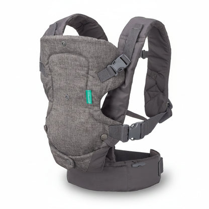 Gray baby carrier with a green tag on a white background