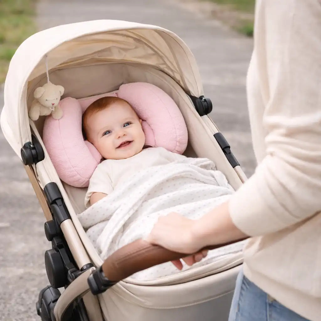 Blue butterfly infant head support cushion shown on a pram or stroller seat