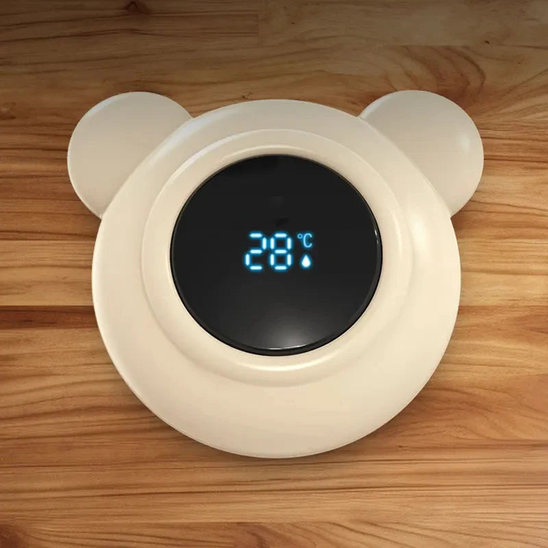 bear bath thermometer sitting on a table displaying room temperature