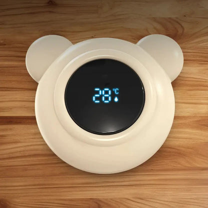 bear bath thermometer sitting on a table displaying room temperature